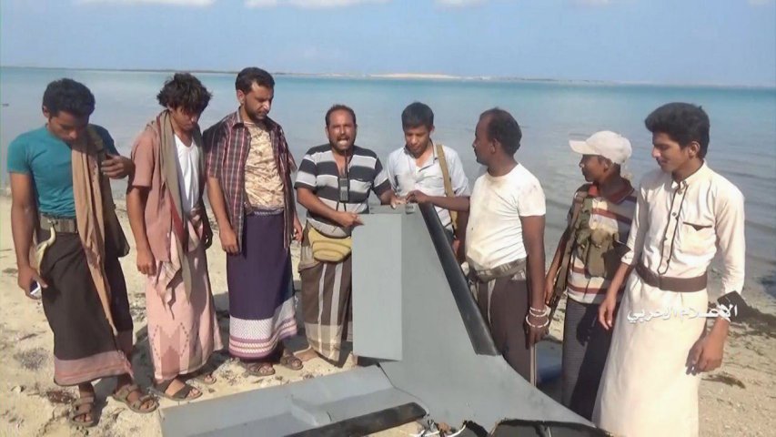 A still from a video released by Ansar Allah (Houthis) on 31 December 2019 shows armed men recovering the wreckage of an aircraft identified as a Karayel UAV operated by Saudi Arabia (Ansar Allah)