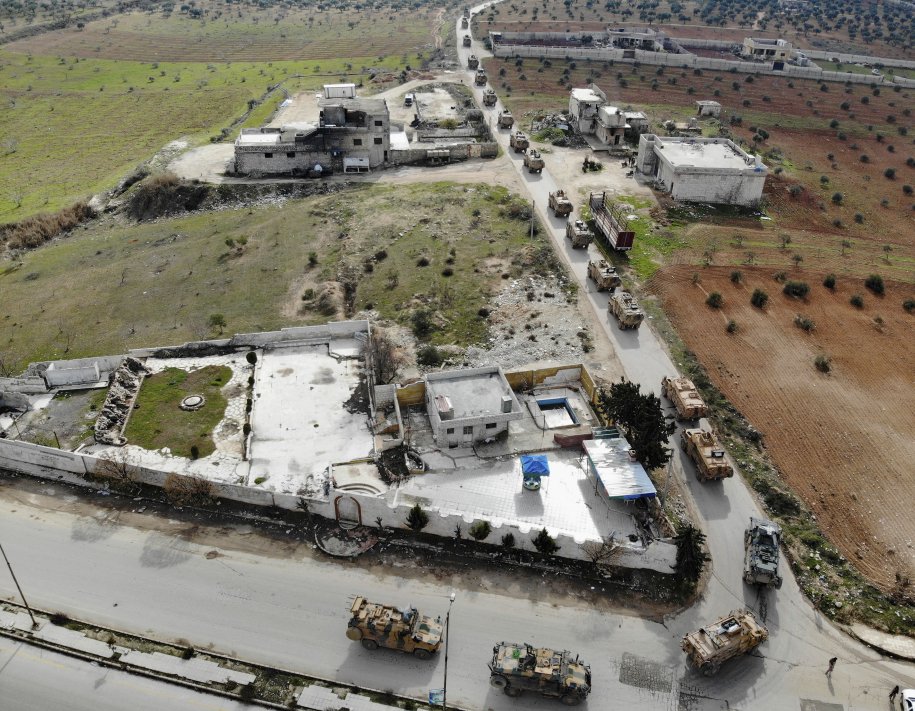 Turkish reinforcements cross the border into Idlib province on 22 February. (Omar Haj Kadour/AFP via Getty Images)