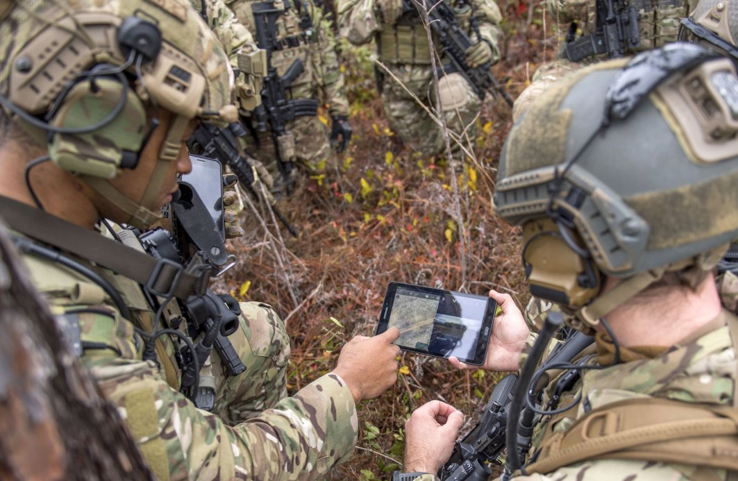 Members of the US Air Force’s 6th Special Operations Squadron use a tablet to upload co-ordinates during an exercise showcasing the capabilities of the Advanced Battle Management System at Duke Field, Florida, on 17 December 2019. (US Air Force)