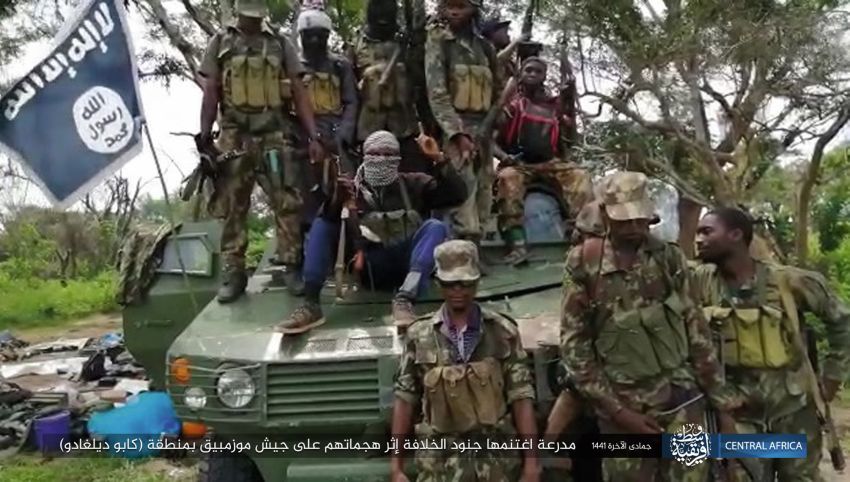 Militants in Mozambique pose with a captured ZBF-05 armoured personnel carrier in a photograph released by the Islamic State’s Amaq News Agency on 2 February. (Amaq News Agency)