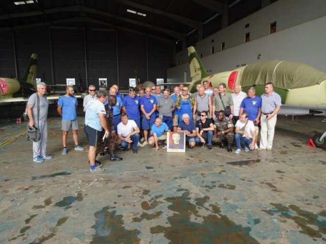 Personnel from Ukraine’s Odessa Aviation Plant (OAP) pose in front of L-39 jets at Uganda’s Gulu Air Base. (UkrOboronProm)