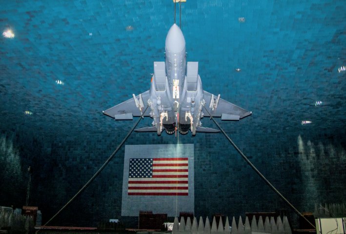 An F-15E Strike Eagle fitted with the EPAWSS electronic defensive aids system in the Benefield Anechoic Facility on Edwards Air Force Base, California. (US Air Force)