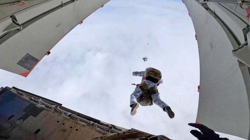 Russia's VDV undertaking the world’s first parachute jump from an aircraft at a height of 10 km in the Arctic close to Franz Josef Land. Russian Defence Minister Sergei Shoigu said Russian paratroopers performed the jump in commemoration of the upcoming 75th anniversary of the Soviet victory in World War 2 and the 90th anniversary of the VDV. (Russian MoD/TASS via Getty Images)