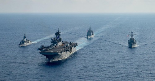 RAN guided-missile frigate HMAS 
        
         (FFH 154), left, sails with USN amphibious assault ship USS 
        
         (LHA 6), guided-missile cruiser USS 
        
         (CG 52) and guided-missile destroyer USS 
        
       ...