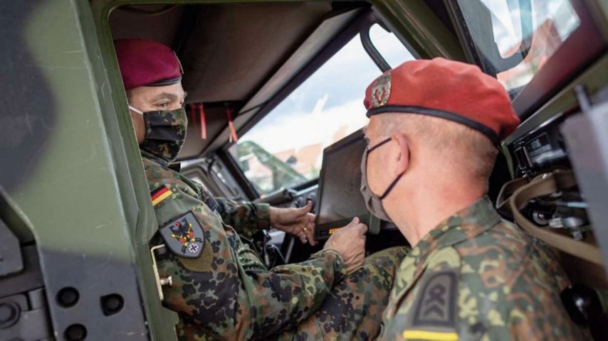 German Army chief Lieutenant General Alfons Mais (left) inspects the service’s new BMS in an Eagle command vehicle during the introduction of the system in Frankenberg.