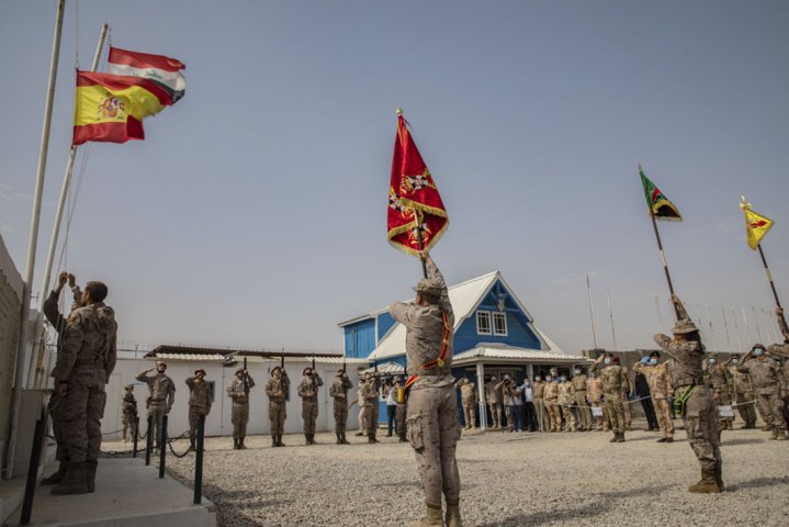 Spanish soldiers serving with the coalition lower their flag at the Besmayah Range Complex as they hand the facility over to the Iraqi Army on 25 July. CJTF-OIR attributed this and other base transfers this year to the success Iraqi forces have had against the Islamic State. (Combined Joint Task Force - Operation Inherent Resolve)