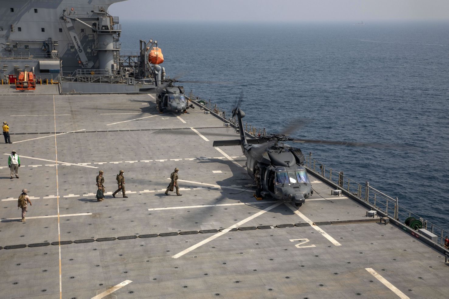 
        US personnel board an Emirati UH-60L Black Hawk that landed on USS 
        Lewis B Puller
         during a live-fire exercise in the Gulf on 11 August.
       (US Marine Corps    )