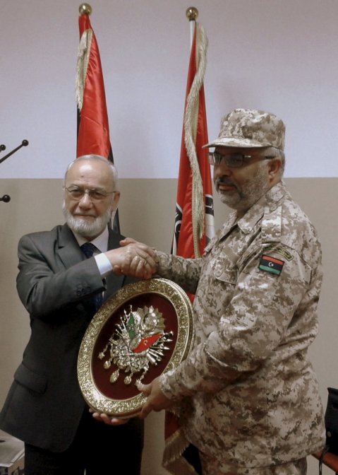 Adnan Tanriverdi (left) in Tripoli in 2013, when Sadat said it was assessing the requirements of Libya’s armed forces. Tanriverdi told Anadolu Agency in 2016 that his company had yet to secure a foreign contract. (Sadat International Defense Consultancy    )