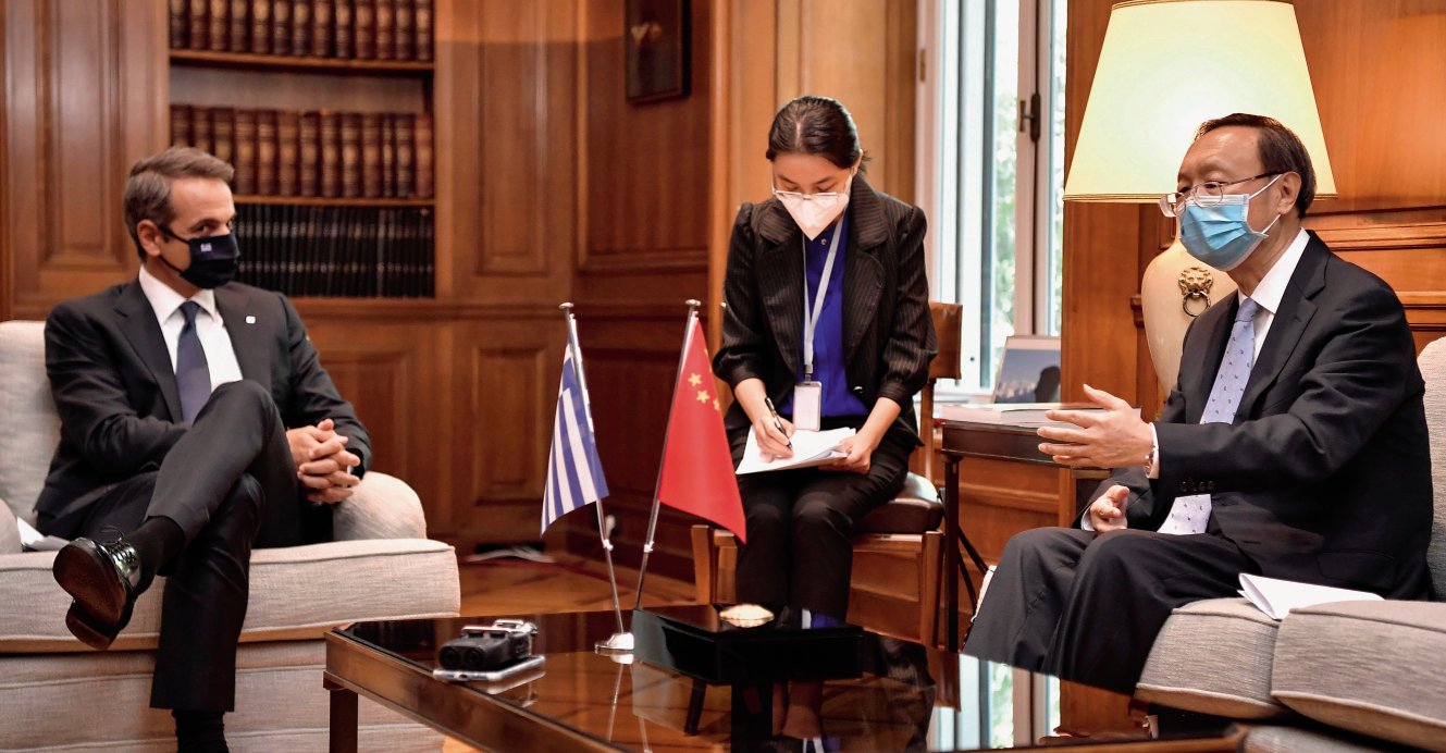 Director of the Central Foreign Affairs Commission of the Chinese Communist Party Yang Jiechi (right) meets Greek Prime Minister Kyriakos Mitsotakis (left) in Athens on 4 September 2020. In Europe, China’s Belt and Road Initiative has found particular uptake in the countries of the Balkan region. (Louisa Gouliamaki/AFP via Getty Images)