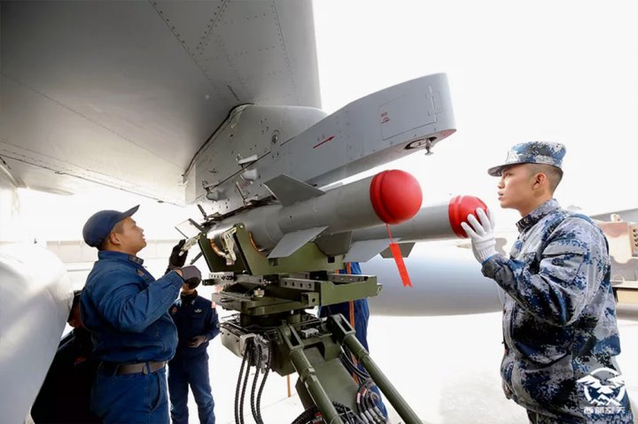 An image published on 17 September on the WeChat account of the Western Theatre Command of the PLAAF showing what appear to be two GB 100 precision-guided bombs being loaded onto a JH-7A fighter-bomber. (PLAAF)