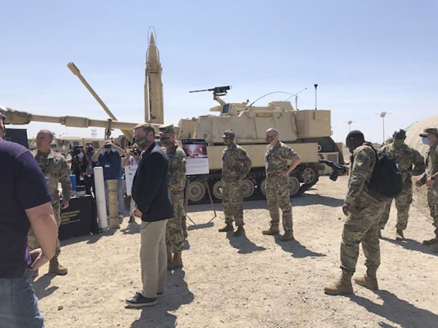 US Army Secretary Ryan McCarthy and Army Chief of Staff Gen James McConville receive a briefing after the Project Convergence 2020 capstone event on 23 September. (Ashley Roque/Janes)