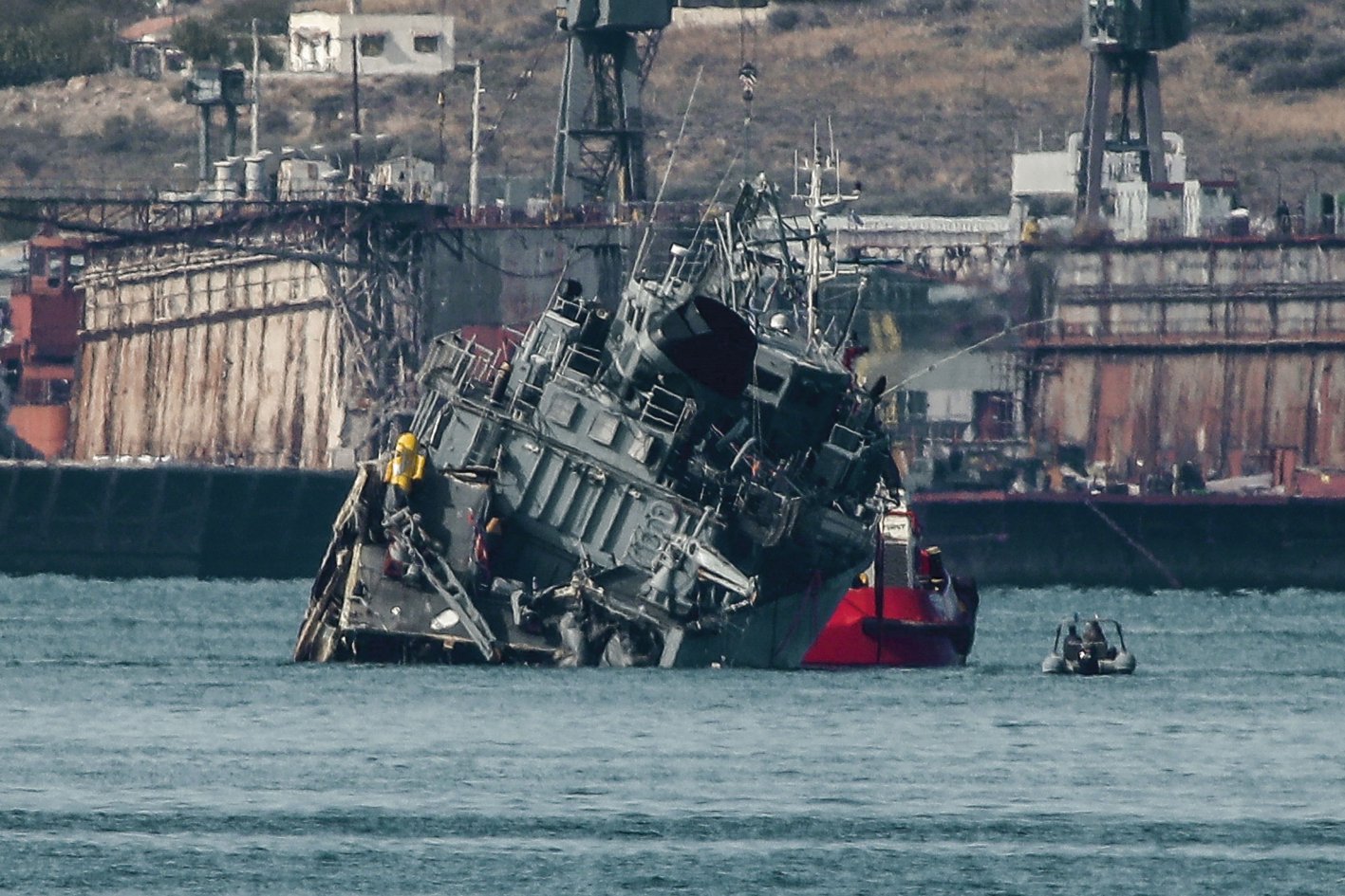 
        The Greek Navy’s minesweeper HS 
        Kallisto
         being towed back to the naval base after colliding with the Portuguese-flagged cargo ship 
        Maersk Launceston
         outside the Port of Piraeus in Athens on 27 October. 
       (Sotiris Dimitropoulos/Eurokinissi/AFP via Getty Images)