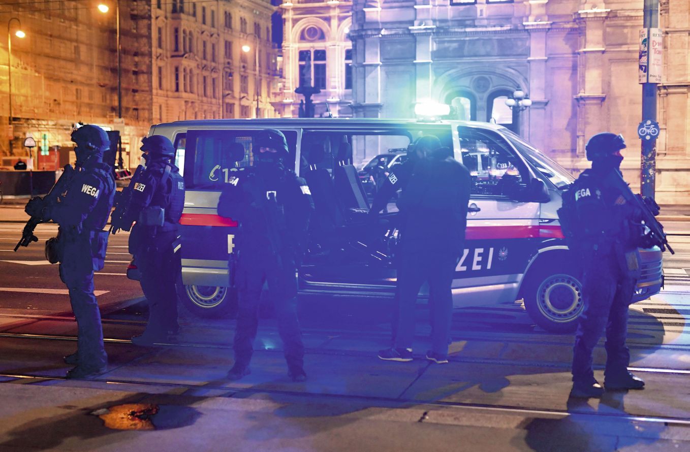 Armed police officers respond to a multiple shooting attack by a suspected Islamist extremist in the central restaurant district of Vienna, Austria, on 2 November. The attack followed a series of Islamist attacks in France. (Joe Klamar/AFP via Getty Images)