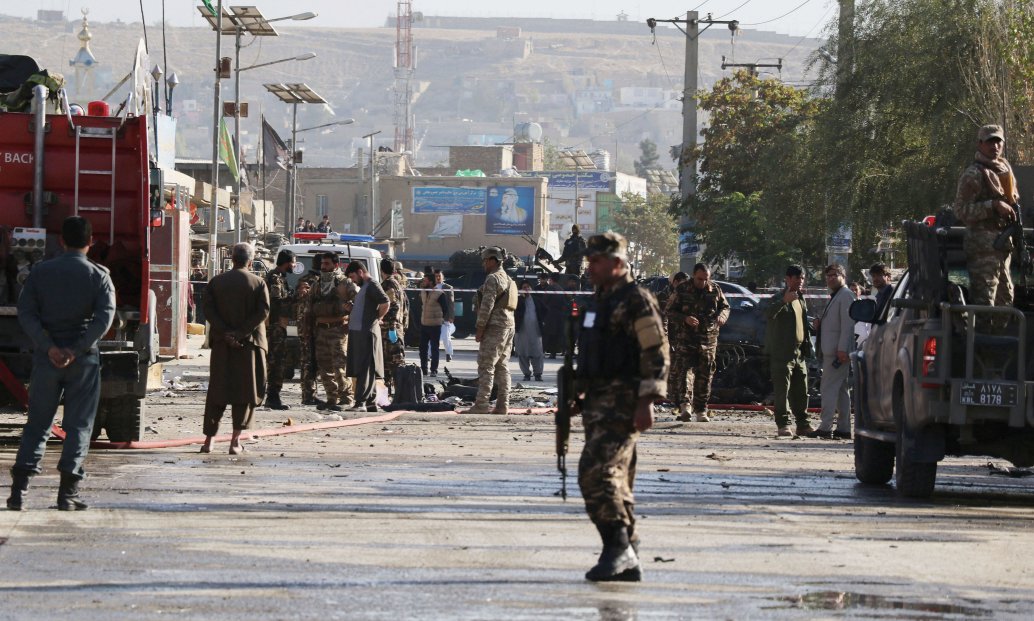 Afghan security forces inspect the scene of a car bomb explosion in Kabul on 27 October that resulted in at least three people being killed and 13 others wounded. The level of violence in Afghanistan remains high, despite ongoing peace talks between the Taliban and the Afghan government.  (Haroon Sabawoon/Anadolu Agency via Getty Images)