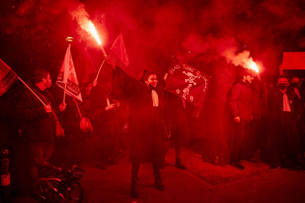 Lawyers and journalists protest outside the National Assembly against the French government's proposed global security law on 17 November 2020 in Paris, France. The protesters included activists, reporters, and unions concerned that Article 24 of the bill could threaten press freedom. (Kiran Ridley/Getty Images)