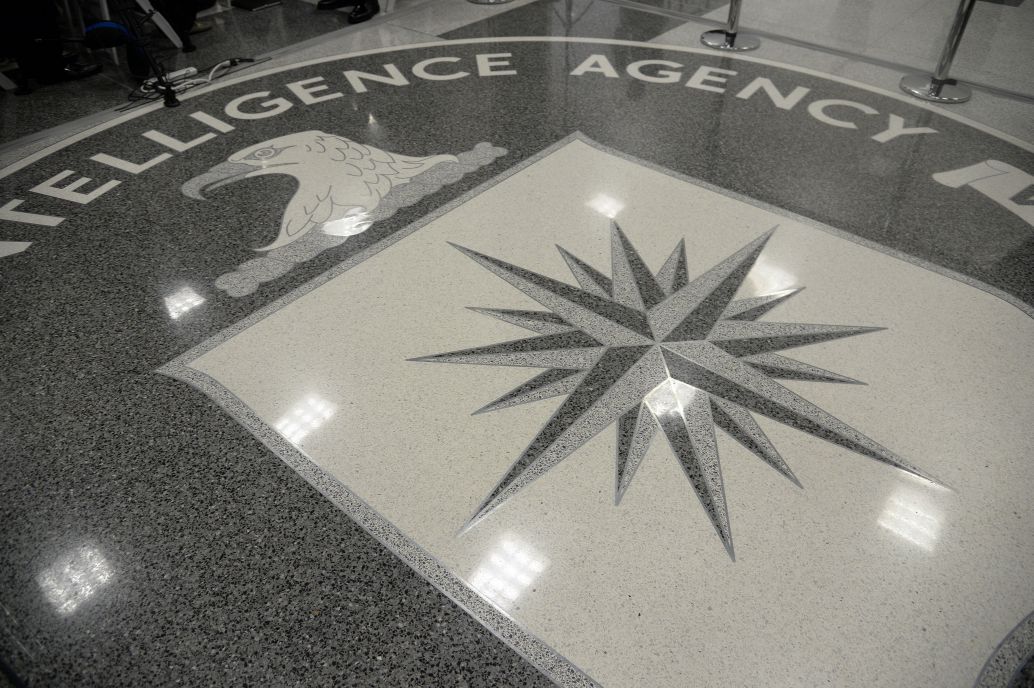 The shield of the CIA  at the agency’s headquarters in Langley, Virginia. During his first official visit to a government agency on 21 January 2017, US President Donald Trump addressed CIA staff, although the executive’s relations with the intelligence community rapidly deteriorated. (Olivier Doulier/Pool/Getty Images)