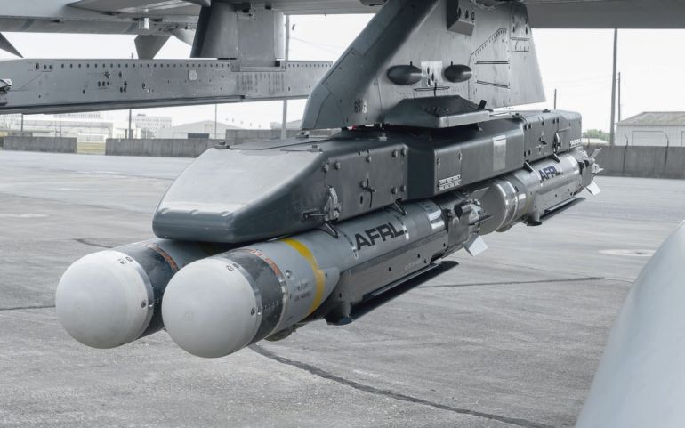 Four CSDB-1 munitions hang from the wing of an F-16 fighter from the US Air Force Test Center’s 96th Test Wing at Eglin Air Force Base, Florida. Two of the bombs were dropped during the first flight demonstration of the Air Force Golden Horde Vanguard. (AFRL)