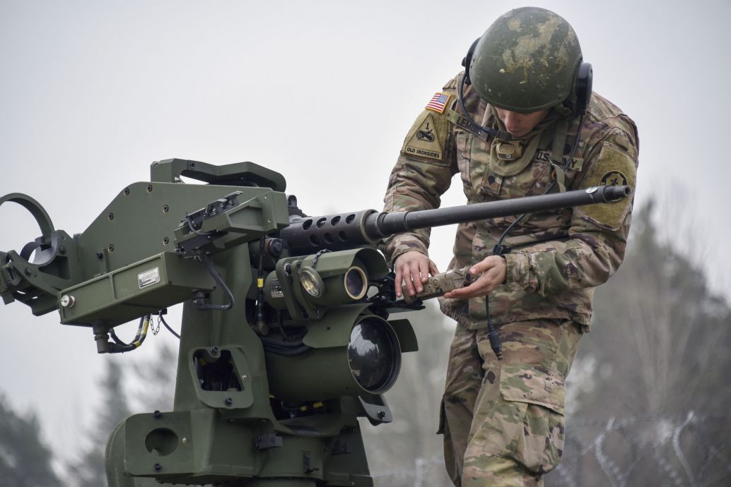 A US soldier assigned to 2nd Cavalry Regiment prepares for a boresight alignment on a CROWS mounted on a Stryker Infantry Carrier Vehicle, in Germany in 2018. The army’s CROWS-J Engineering Change Proposal has been delayed due to software problems and Covid-19. (US Army )