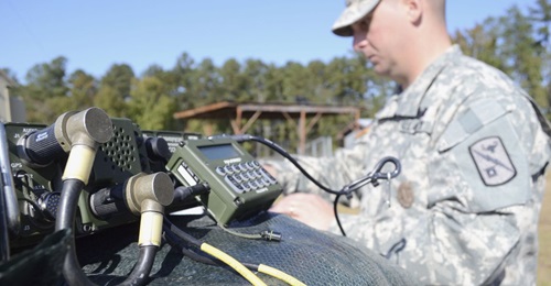 A US Army radio operator-maintainer works on an AN/PRC 1510 high-frequency radio at Fort Gordon, Georgia.