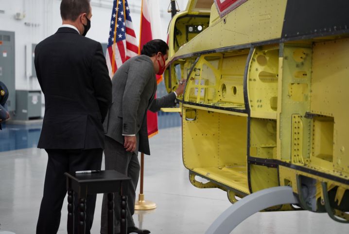 Bahrain Ambassador to United States, Shaikh Abdulla Al Khalifa, signs the first of 12 AH-1Z attack helicopters for the Royal Bahraini Air Force during a visit to Bell’s Amarillo production plant in Texas.  (Bell)