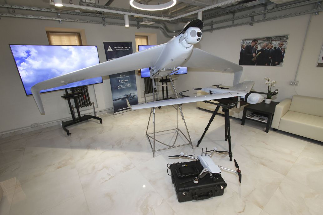 ZALA Aero unveiled the ZALA 421-16E5G UAV with a hybrid powerplant (on stand) and a UAS navigation system that does not depend on GLONASS/GPS satellite navigation (on floor) on 14 April. (Denis Fedutinov)