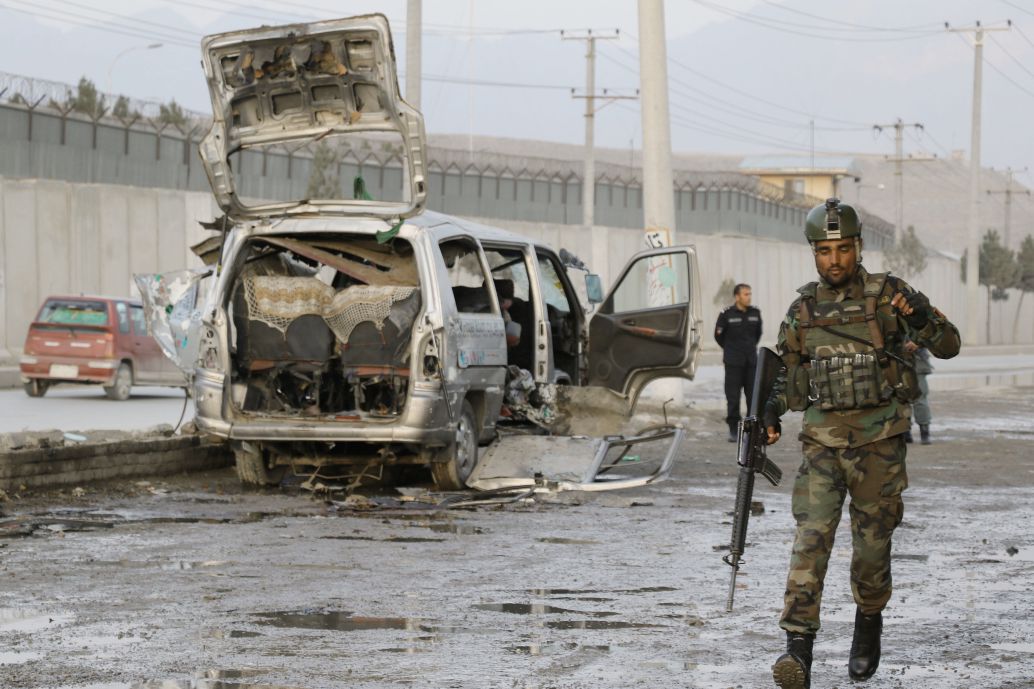 Afghan security officials inspect the scene of bomb blast in Kabul on 7 March that killed and wounded several civilians. The high levels of violence during the first quarter of this year have resulted in a considerable increase in the number of civilian casualties in Afghanistan compared to the same period in 2020 (Haroon Sabawoon/Anadolu Agency via Getty Images)